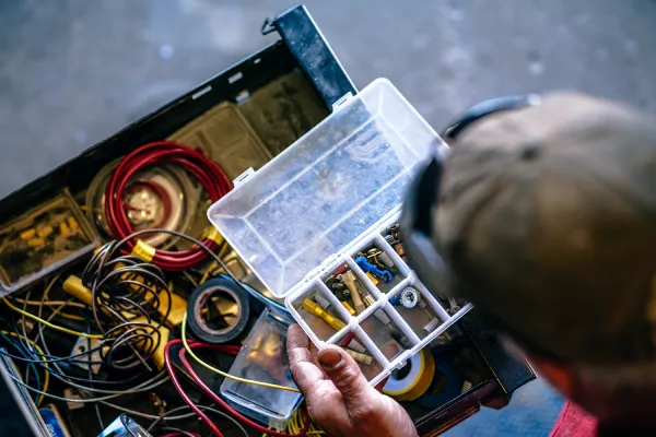 cropped-image-hands-holding-tool